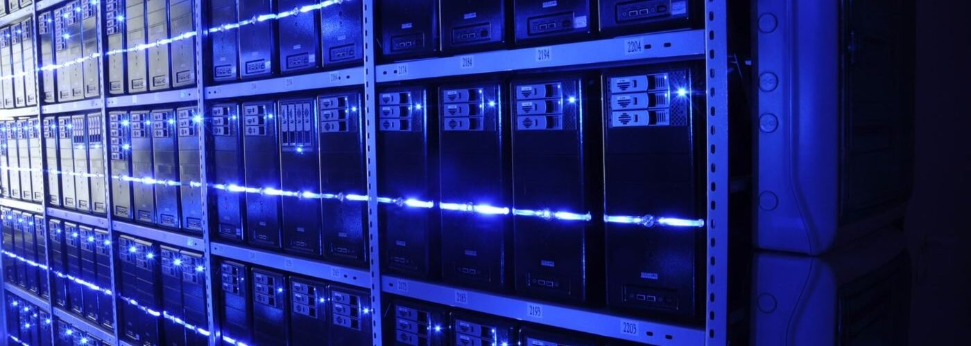Engineer inspecting servers in a modern data center