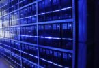 Engineer inspecting servers in a modern data center