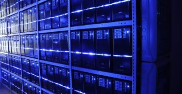 Engineer inspecting servers in a modern data center
