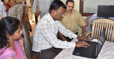 students using refurbished laptops in a classroom