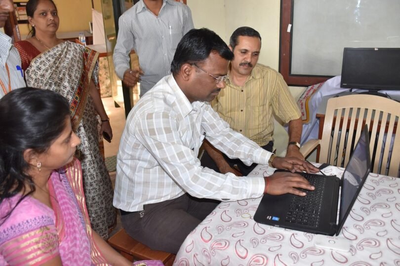 students using refurbished laptops in a classroom