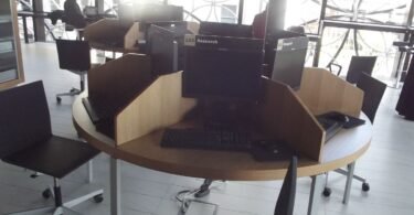 adults learning computer skills in a training classroom