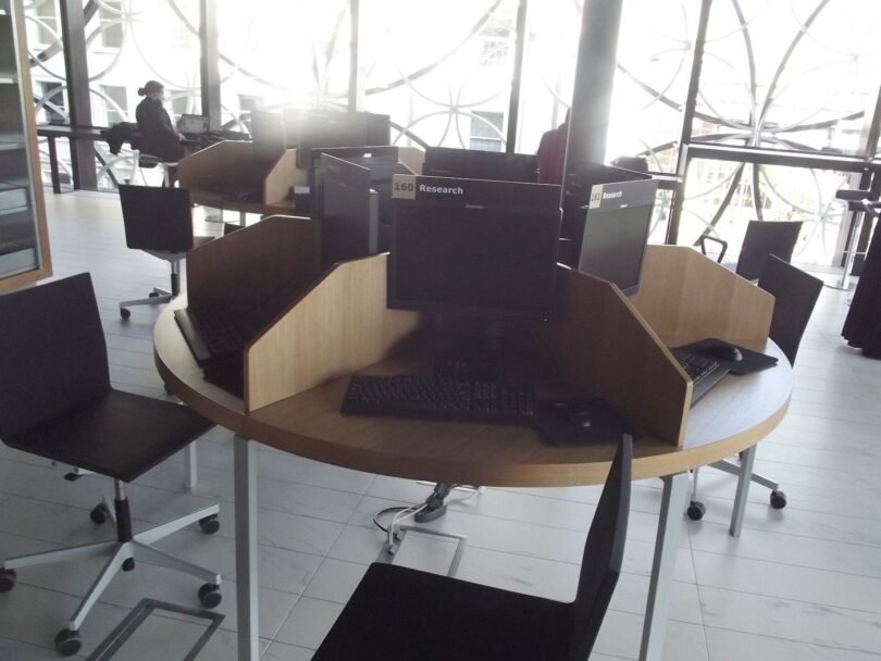 adults learning computer skills in a training classroom